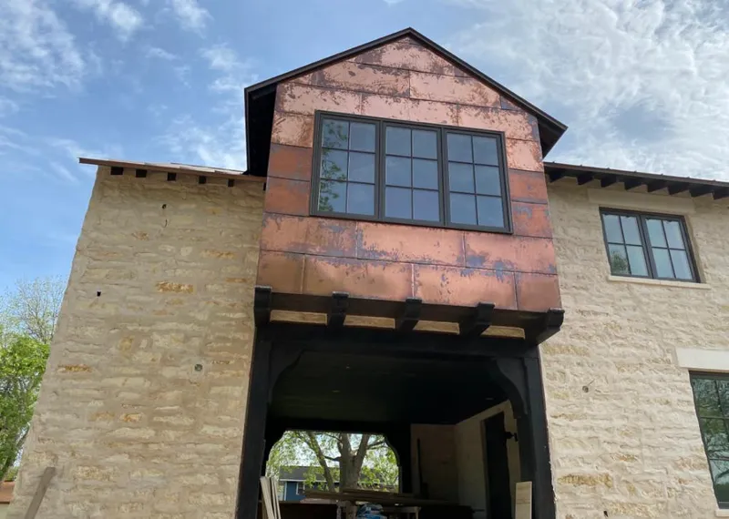 Copper metal panel facade on a stone building for Metal Roof Coating in Corinth